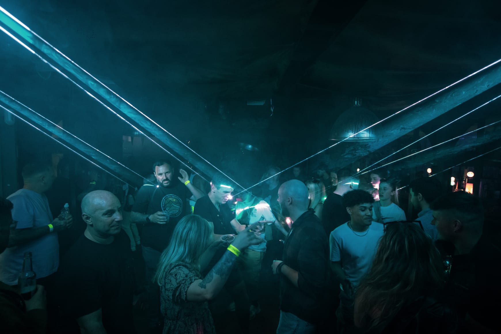 Crowd in the laser fog